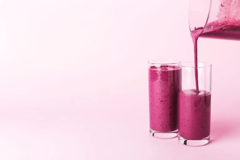 Two Glasses Of Blueberries Smoothie.